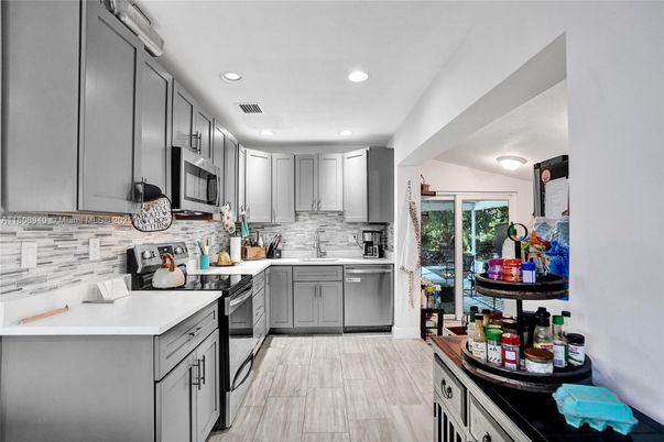 Interior, Kitchen, Recessed Lighting, Stainless Steel Appliances, Wood Texture Flooring
