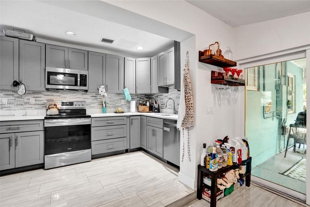 Interior, Kitchen, Recessed Lighting, Stainless Steel Appliances, Wood Texture Flooring