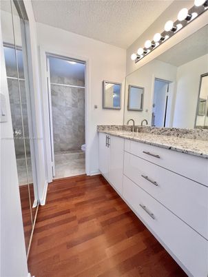 Bathroom, Dual Sink Vanities, Glass Shower, Interior, Wood Texture Flooring
