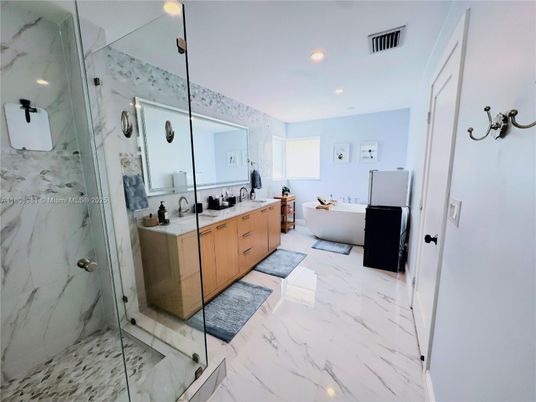 Bathroom, Dual Sink Vanities, Free Standing Baths, Glass Shower, Interior, Marble, Marble Walls, Recessed Lighting