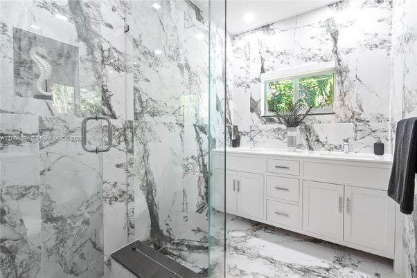 Bathroom, Dual Sink Vanities, Glass Shower, Interior, Marble, Marble Walls, Recessed Lighting