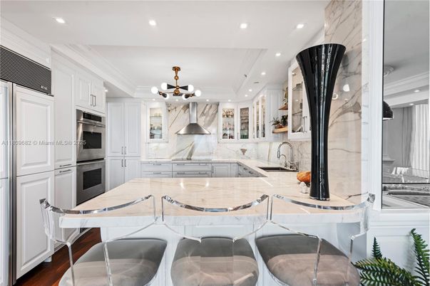 Interior, Kitchen, Marble Walls, Pendant Lights, Recessed Lighting, Stainless Steel Appliances, Wood Texture Flooring