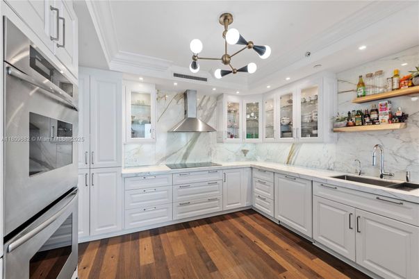 Interior, Kitchen, Marble Walls, Pendant Lights, Recessed Lighting, Stainless Steel Appliances, Wood Texture Flooring