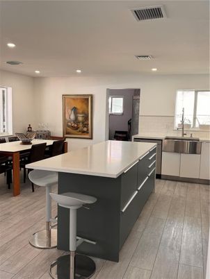Dining room, Interior, Kitchen, Recessed Lighting, Stainless Steel Appliances, Wood Texture Flooring