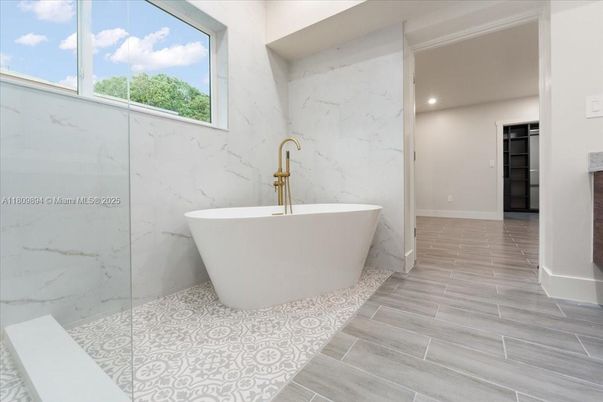 Bathroom, Free Standing Baths, Glass Shower, Interior, Marble Walls, Recessed Lighting