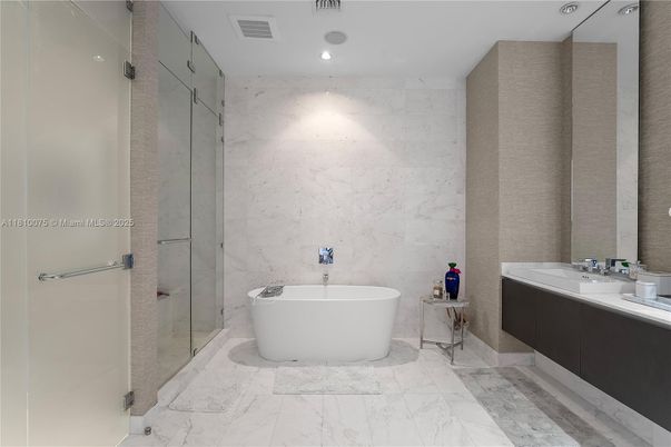 Bathroom, Dual Sink Vanities, Free Standing Baths, Glass Shower, Interior, Marble, Marble Walls, Recessed Lighting