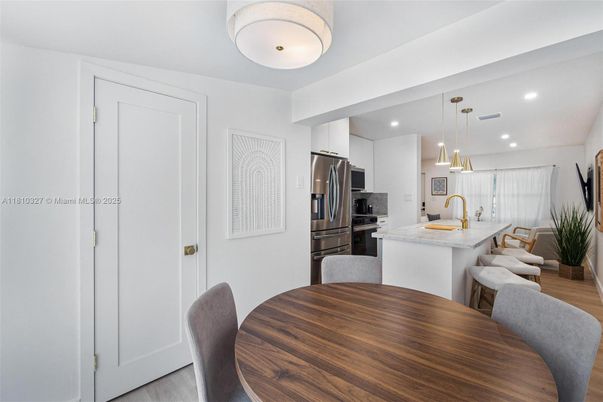 Dining room, Interior, Kitchen, Pendant Lights, Recessed Lighting, Stainless Steel Appliances, Wood Texture Flooring