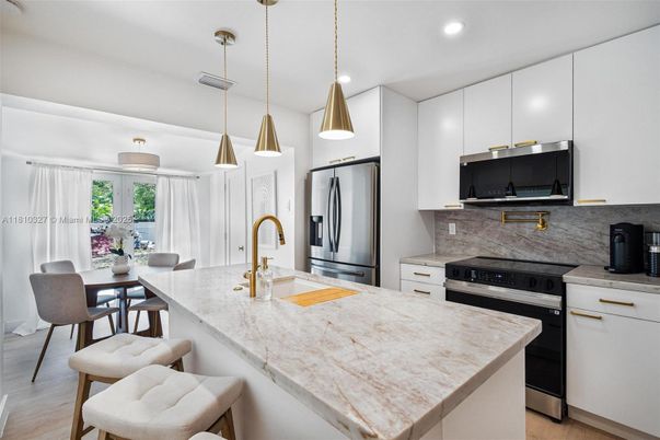 Dining room, Interior, Kitchen, Pendant Lights, Recessed Lighting, Stainless Steel Appliances, Wood Texture Flooring