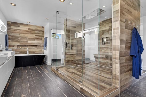 Bathroom, Free Standing Baths, Glass Shower, Interior, Recessed Lighting, Wood Texture Flooring, Wooden Walls