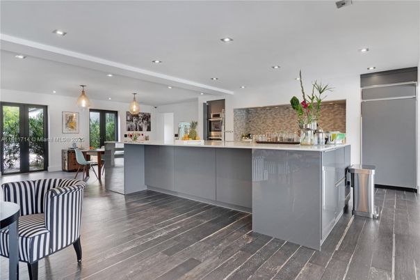 Dining room, Interior, Kitchen, Pendant Lights, Recessed Lighting, Stainless Steel Appliances, Wood Texture Flooring