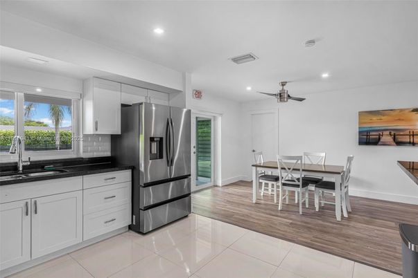 Dining room, Interior, Kitchen, Recessed Lighting, Stainless Steel Appliances, Wood Texture Flooring