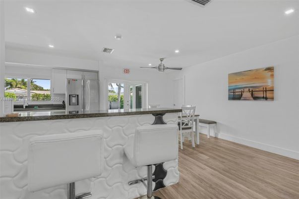 Dining room, Interior, Kitchen, Recessed Lighting, Stainless Steel Appliances, Wood Texture Flooring