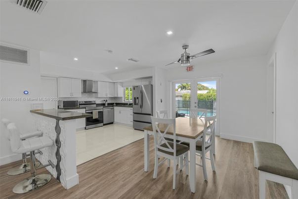 Dining room, Interior, Kitchen, Recessed Lighting, Stainless Steel Appliances, Wood Texture Flooring