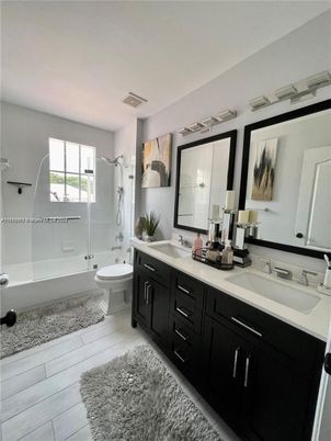 Bathroom, Dual Sink Vanities, Glass Shower, Interior, Wood Texture Flooring
