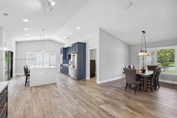 Dining room, Interior, Kitchen, Pendant Lights, Recessed Lighting, Stainless Steel Appliances, Wood Texture Flooring