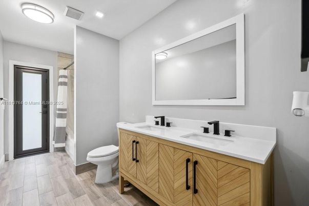 Bathroom, Dual Sink Vanities, Interior, Recessed Lighting, Wood Texture Flooring