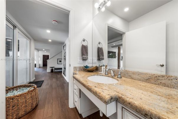 Bathroom, Dual Sink Vanities, Interior, Recessed Lighting, Wood Texture Flooring