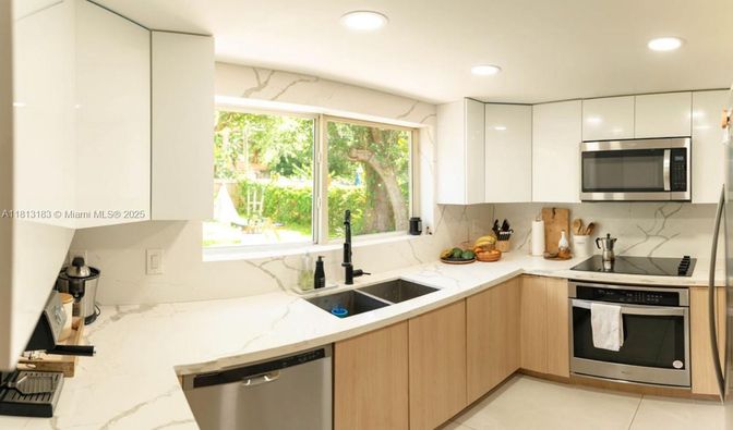 Interior, Kitchen, Marble Walls, Recessed Lighting, Stainless Steel Appliances
