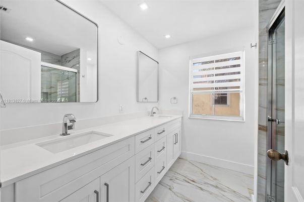 Bathroom, Dual Sink Vanities, Glass Shower, Interior, Marble, Recessed Lighting