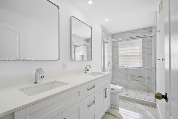 Bathroom, Dual Sink Vanities, Glass Shower, Interior, Marble, Marble Walls, Recessed Lighting