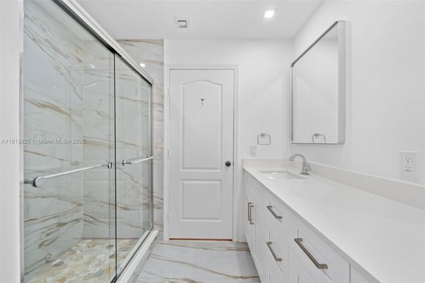 Bathroom, Dual Sink Vanities, Glass Shower, Interior, Marble, Marble Walls, Recessed Lighting