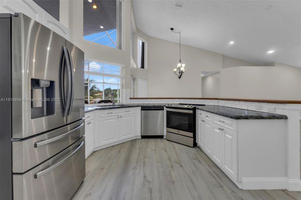 Chandelier, Interior, Kitchen, Pendant Lights, Recessed Lighting, Stainless Steel Appliances, Wood Texture Flooring