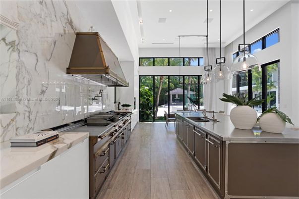 Interior, Kitchen, Marble Walls, Pendant Lights, Recessed Lighting, Stainless Steel Appliances, Wood Texture Flooring