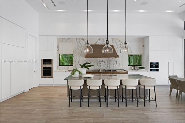 Interior, Kitchen, Marble Walls, Pendant Lights, Recessed Lighting, Stainless Steel Appliances, Wood Texture Flooring