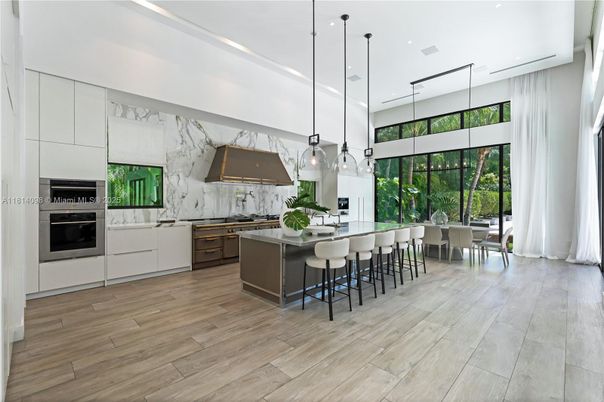 Dining room, Interior, Kitchen, Marble Walls, Pendant Lights, Recessed Lighting, Stainless Steel Appliances, Wood Texture Flooring