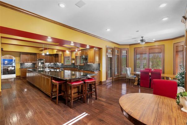 Dining room, Interior, Kitchen, Living room, Recessed Lighting, Stainless Steel Appliances, Wood Texture Flooring
