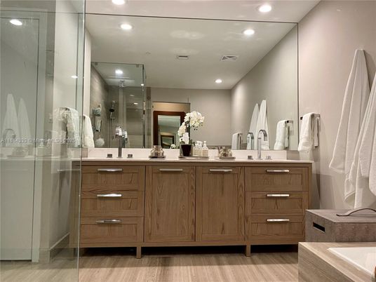 Bathroom, Dual Sink Vanities, Glass Shower, Interior, Recessed Lighting, Wood Texture Flooring