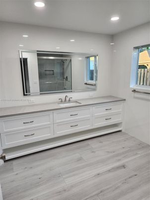 Bathroom, Dual Sink Vanities, Interior, Recessed Lighting, Wood Texture Flooring