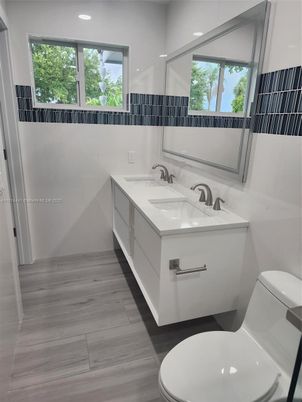 Bathroom, Dual Sink Vanities, Interior, Recessed Lighting, Wood Texture Flooring