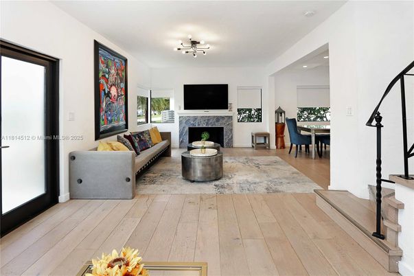 Dining room, Fireplace, Interior, Living room, Recessed Lighting, Wood Texture Flooring