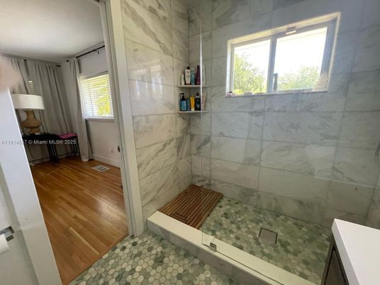 Bathroom, Glass Shower, Interior, Marble Walls, Wood Texture Flooring