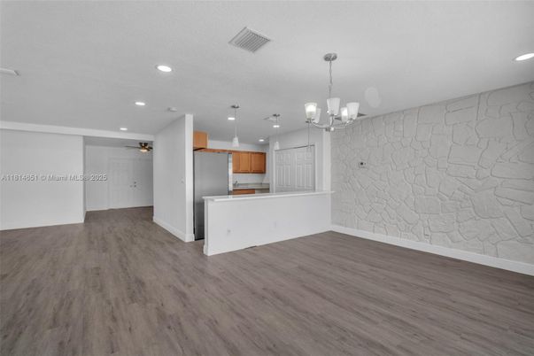 Chandelier, Empty room, Interior, Kitchen, Pendant Lights, Recessed Lighting, Stone Walls, Wood Texture Flooring