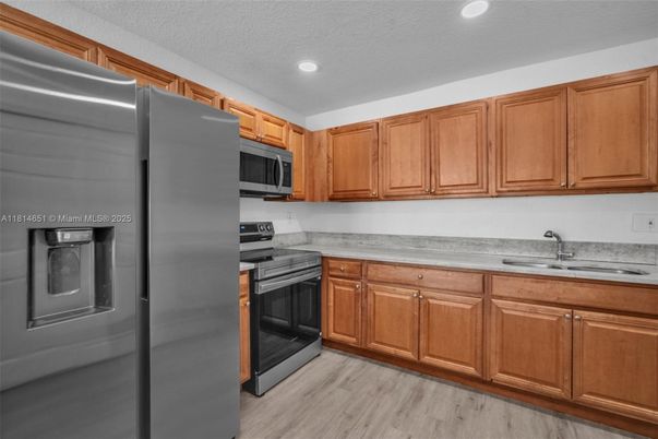 Interior, Kitchen, Recessed Lighting, Stainless Steel Appliances, Wood Texture Flooring