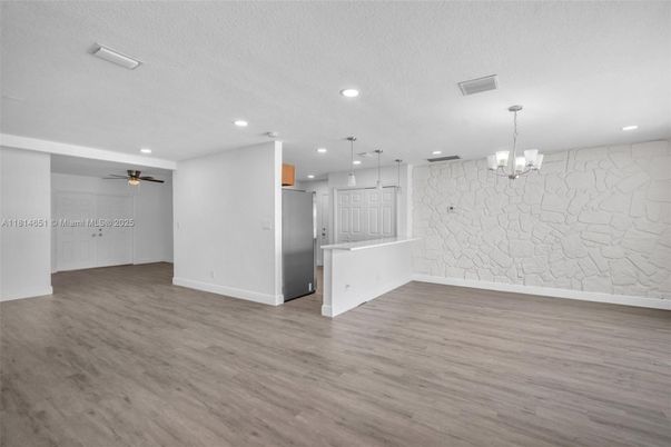 Chandelier, Empty room, Interior, Kitchen, Pendant Lights, Recessed Lighting, Stone Walls, Wood Texture Flooring