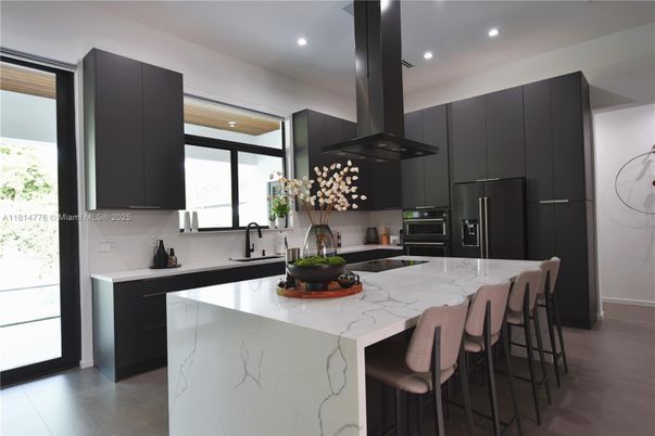 Interior, Kitchen, Marble Walls, Recessed Lighting, Stainless Steel Appliances