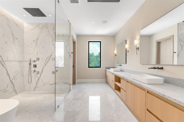 Bathroom, Dual Sink Vanities, Glass Shower, Interior, Marble, Marble Walls, Recessed Lighting