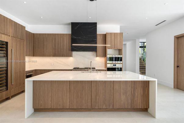 Interior, Kitchen, Marble Walls, Pendant Lights, Recessed Lighting, Stainless Steel Appliances