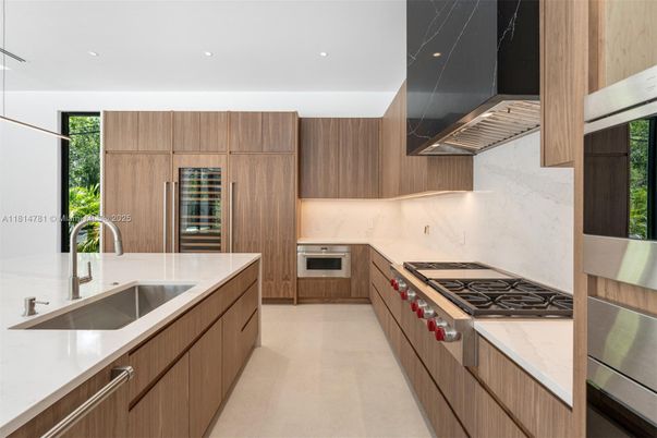 Interior, Kitchen, Marble Walls, Recessed Lighting, Stainless Steel Appliances