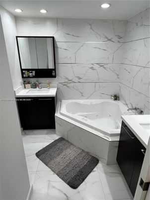 Bathroom, Dual Sink Vanities, Interior, Marble, Marble Walls, Recessed Lighting
