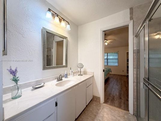 Bathroom, Dual Sink Vanities, Glass Shower, Interior, Wood Texture Flooring