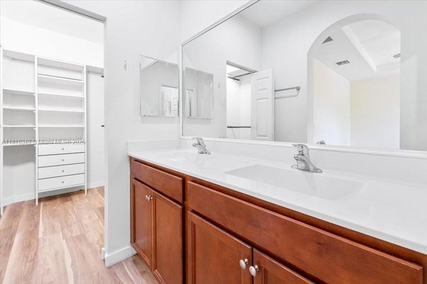 Bathroom, Dual Sink Vanities, Interior, Walk-in Closets, Wood Texture Flooring