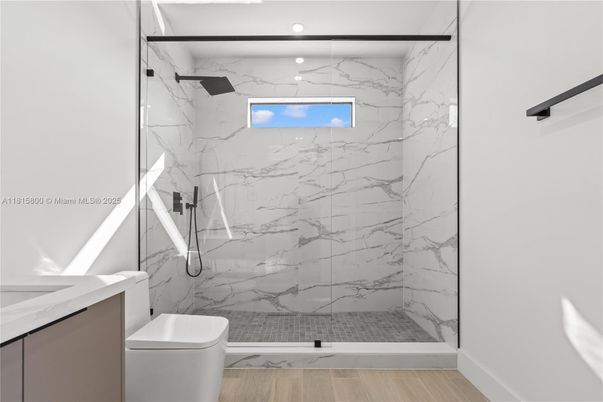 Bathroom, Glass Shower, Interior, Marble Walls, Recessed Lighting, Wood Texture Flooring