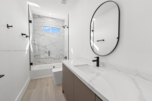 Bathroom, Glass Shower, Interior, Marble Walls, Recessed Lighting, Wood Texture Flooring