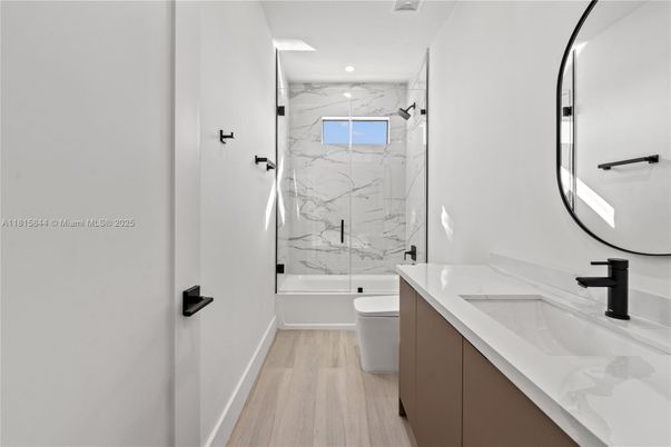 Bathroom, Glass Shower, Interior, Marble Walls, Recessed Lighting, Wood Texture Flooring