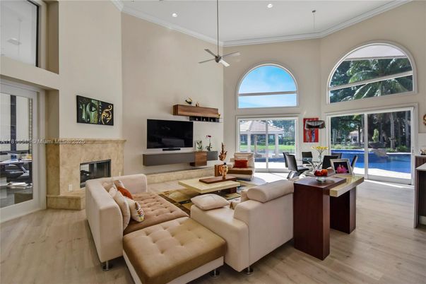 Dining room, Fireplace, Interior, Living room, Pendant Lights, Recessed Lighting, Wood Texture Flooring