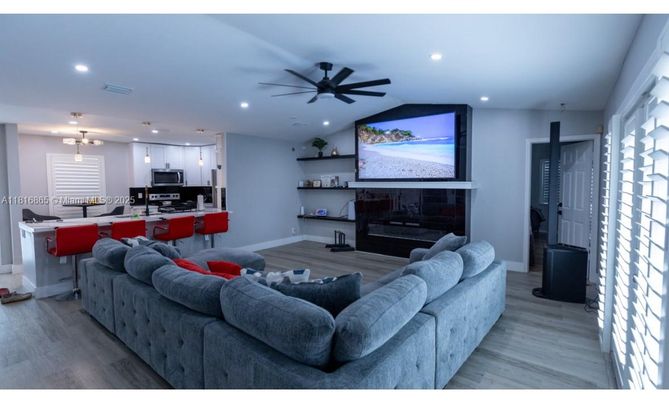 Fireplace, Interior, Kitchen, Living room, Pendant Lights, Recessed Lighting, Stainless Steel Appliances, Wood Texture Flooring